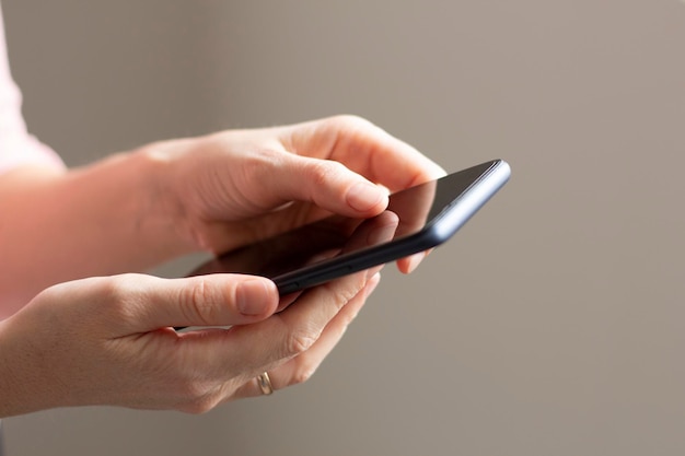 Smartphone in the hands of a woman