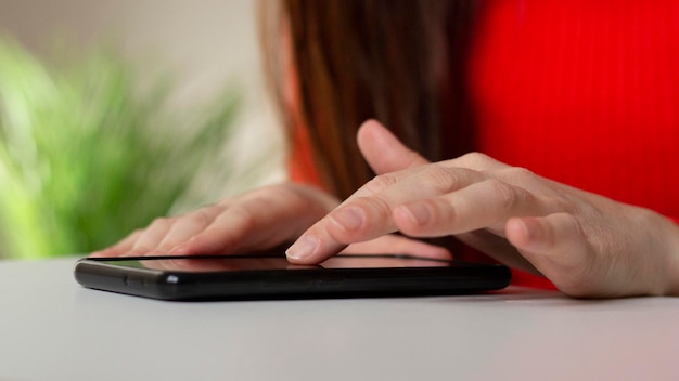 Smartphone in the hands of a woman