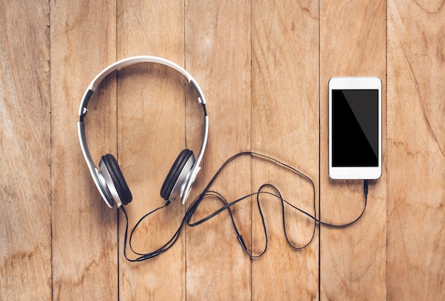 Smartphone and Headphones on table