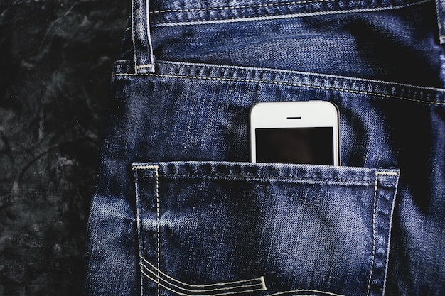 Smartphone in jeans pocket