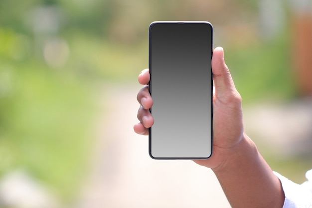 smartphone landscape in the palm of your hand. blank smartphone screen for mockup design needs