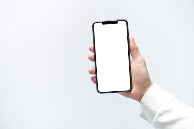 Smartphone mockup. Businesswoman hand holding black phone white screen