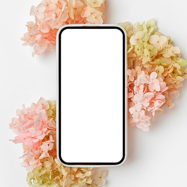 Smartphone mockup with pink and green flowers Device screen mock up on stylish background for presentation or appl design