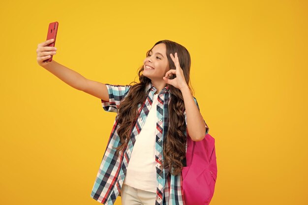 Smartphone and school child student girl with phone