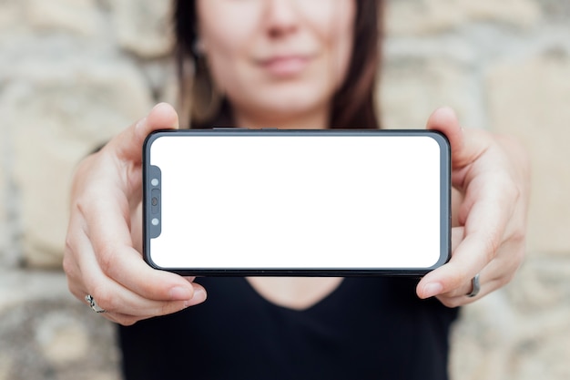 Smartphone screen hold by a person