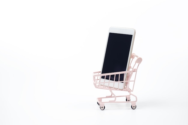 Smartphone on shopping cart white background. Shopping online supermarket on internet. business sale purchase digital marketing.