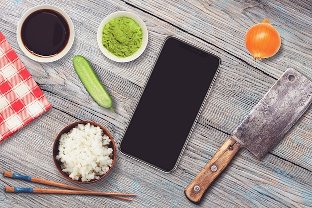 Smartphone in a sushi bar restaurant scene