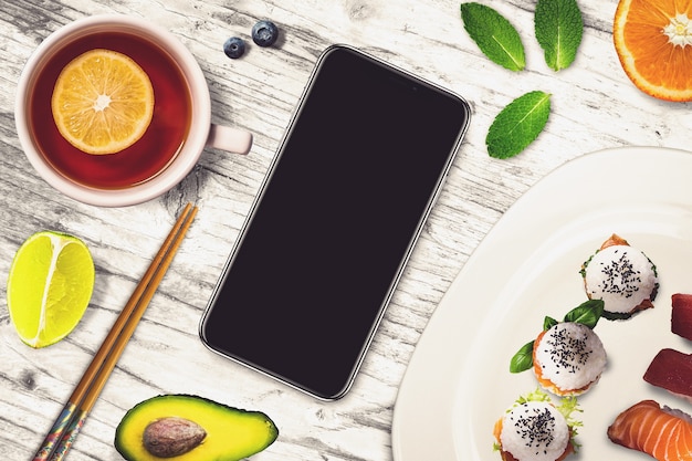 Smartphone in a sushi bar scene