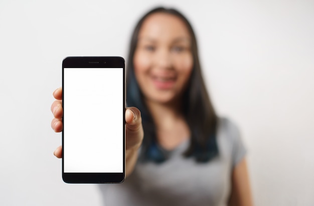 Smartphone with blank white screen in female hand