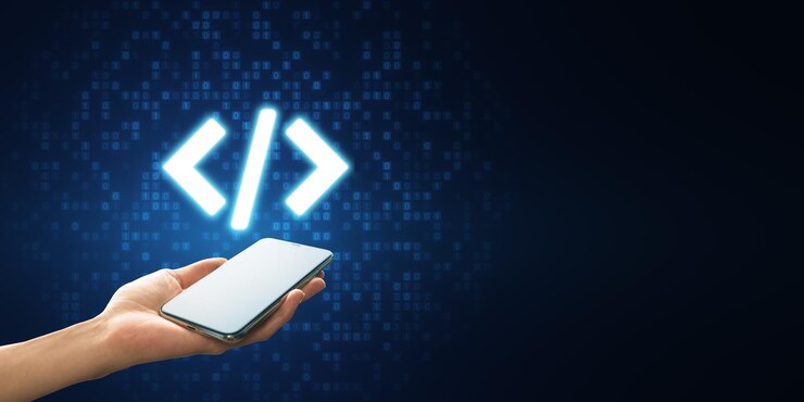 Photo smartphone with coding icon over hand on dark digital background
