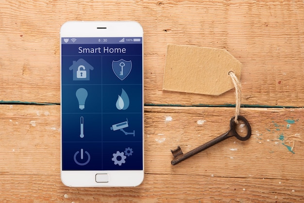 Smartphone with smart home app on the wooden desk