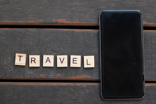 smartphone with white screen and travel alphabet