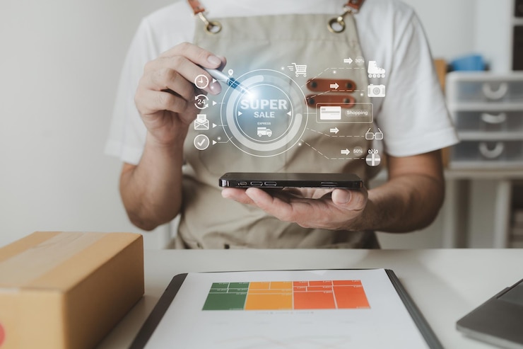 Photo smartphones are being used to do various activities to promote sales to stores owner of an online store packs products into parcel boxes based on orders from online sales sites