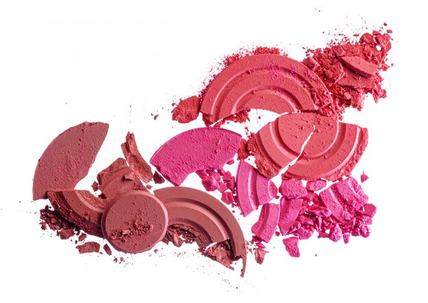 Smashed pink blush cosmetics isolated on white