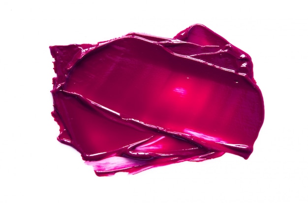 Smear and texture of purple lipstick or oil paint isolated. 