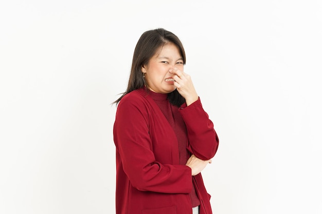 Smelling something stinky and disgusting Of Beautiful Asian Woman Wearing Red Shirt