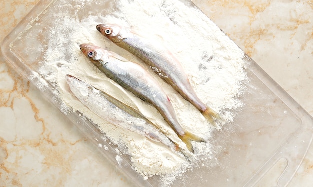 Smelt dusted fish in flour