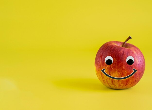 Smile Apple On Yellow Background World Smile Day