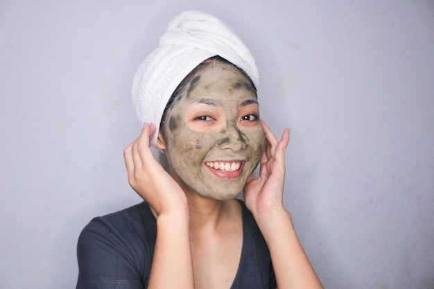 Smile Asian women smiling when she use beauty face mask