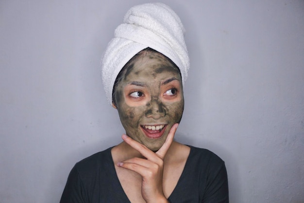 Smile Asian women smiling when she use beauty face mask