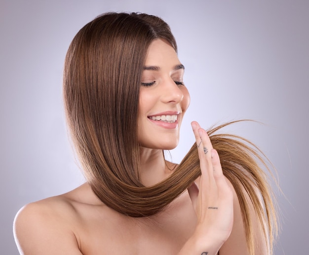 smile beauty and haircare of a woman with straight hair in studio isolated on a background natural cosmetics growth or happy female model with salon treatment for healthy keratin or long hairstyle