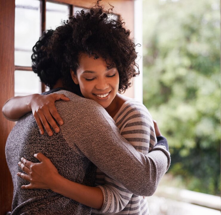 Photo smile couple and hug at door for welcome greeting or meeting together in home happy woman man and embrace at doorway for visit support and romantic connection for love in healthy relationship