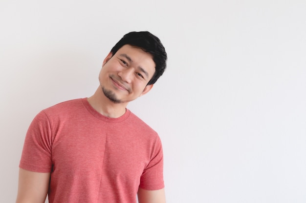 Smile face of happy man in red tshirt isolated on white background