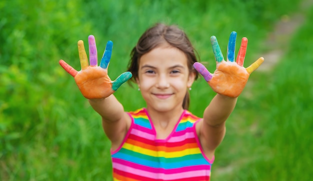 Smile on the hands of a child drawing. 