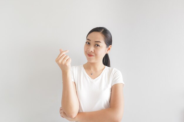 Smile and happy woman in white t-shirt. Concept of happy and thinking positive.