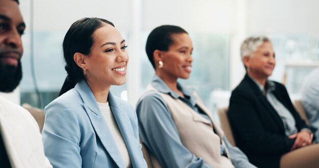 Photo smile laughing a business woman in a meeting with her colleagues for training in a workshop or seminar corporate conference or education with a happy employee in the boardroom of an office