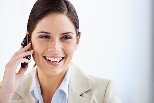 smile phone call and business woman in office with space for networking chat or communication on white background smartphone conversation or happy lady entrepreneur talking consulting or contact
