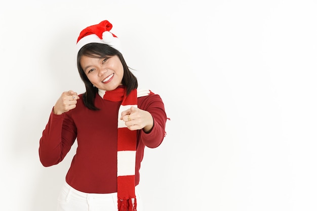 Smile And Pointing At You of Beautiful Asian Woman Wearing Red Turtleneck and Santa Hat