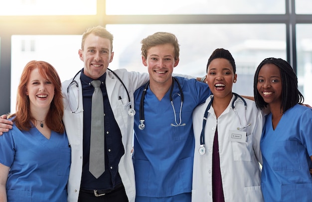 Smile portrait and medical team in hospital for diversity about us or support in clinic service Face happy people and healthcare group doctors or expert professional nurses together for wellness