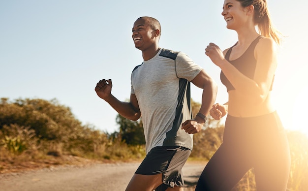 Photo smile running and health with couple in road for workout cardio performance and summer marathon exercise and teamwork with black man and woman runner in nature for sports training and race