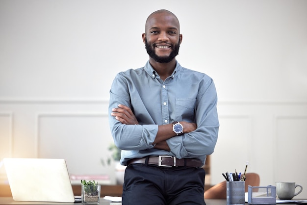 Smile startup and portrait of black man entrepreneur in corporate company or agency office arms crossed Professional African and happy young person or employee ready for business development