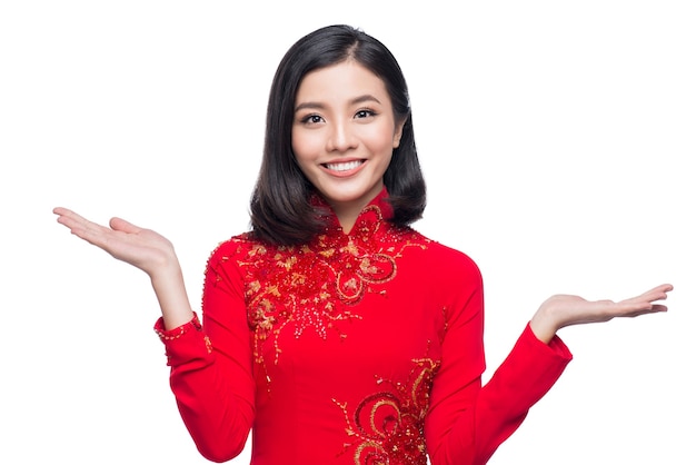 Smile Vietnamese woman in dress traditional Ao Dai and introduce on white background.