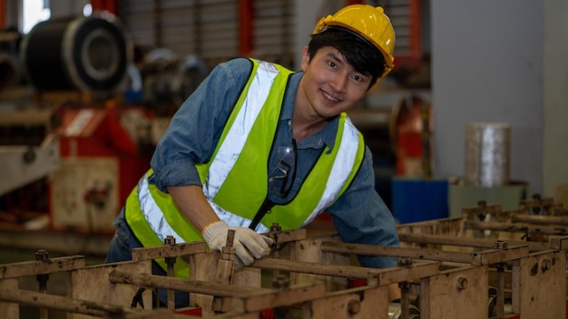 Smile woman heavy industry worker in manufacturing factory