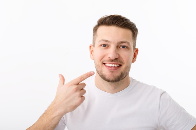 The smile of a young man in closeup The result of teeth whitening