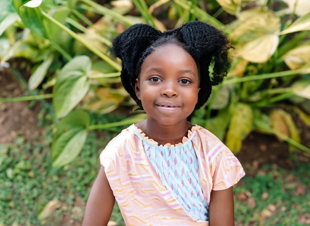 Premium AI Image | Smiley African Child outdoor generative ai