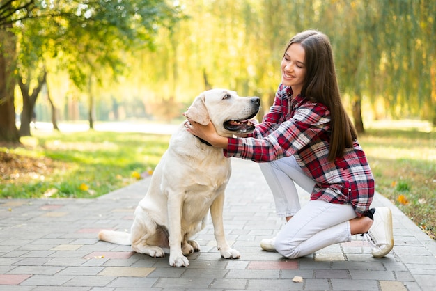 Smiley woman in love with her dog