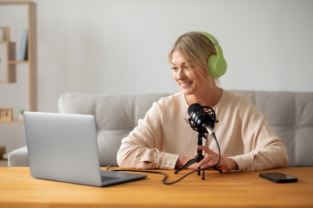 smiley woman with headphones medium shot