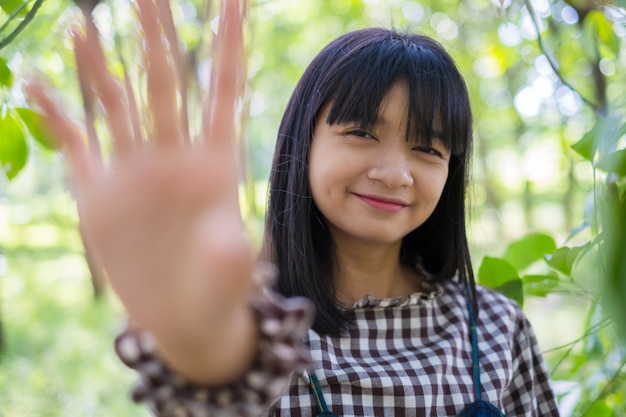 Smiley young girl on nature background