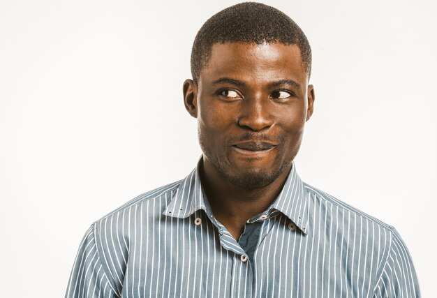 Smiling African American man looking at side.