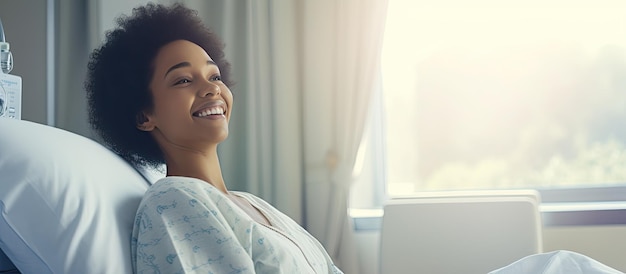 Smiling African American woman in hospital bed