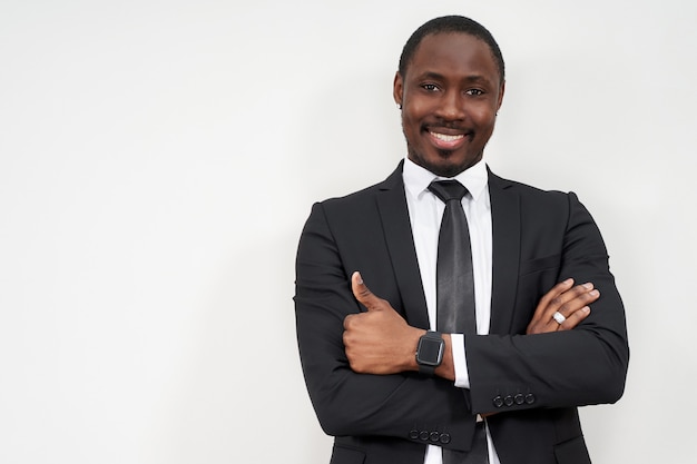 Smiling african businessman with thumbs up