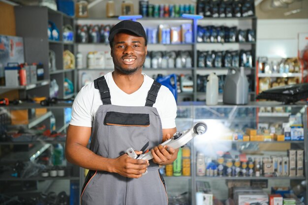 Smiling african Salesman Auto Parts Store