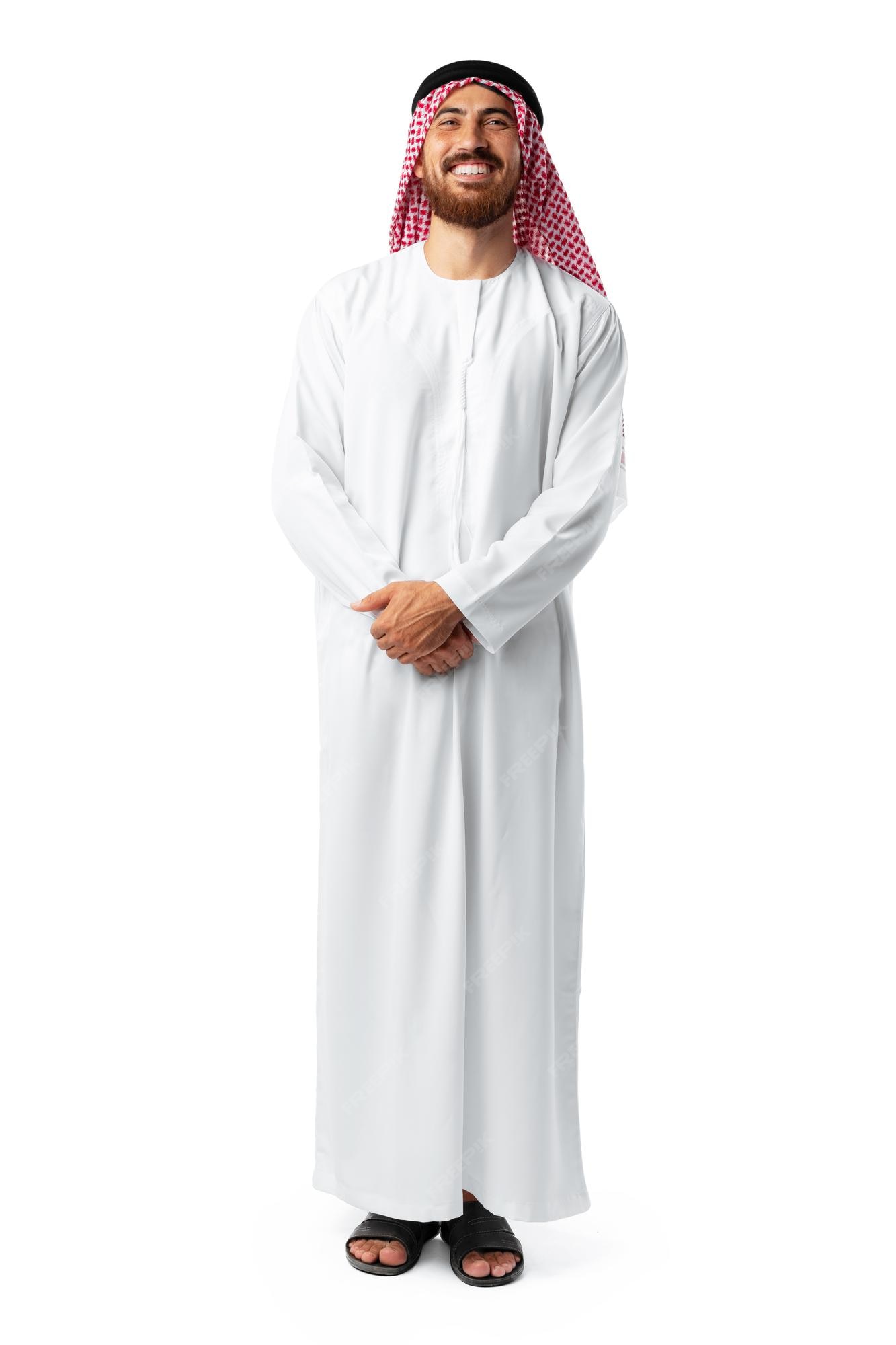Premium Photo | Smiling arab man while standing in a white studio