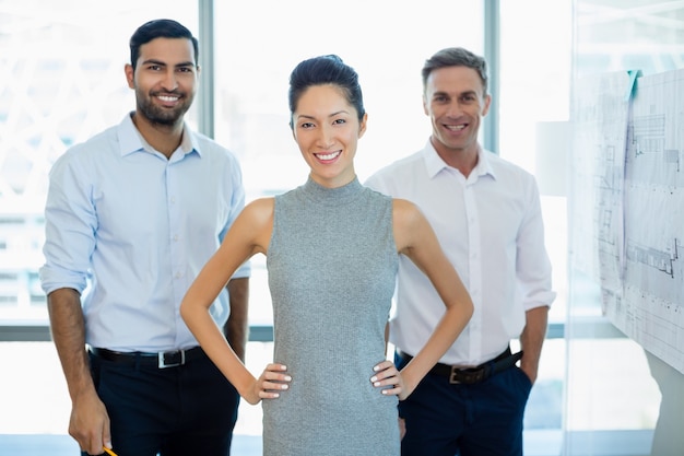 Smiling architects standing in office