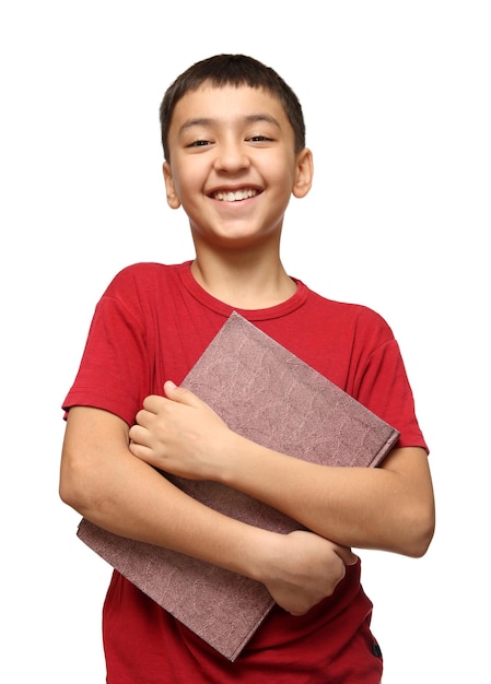 Smiling asian boy holding big book