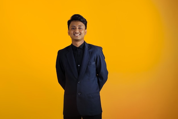 Smiling asian boy in office style wearing suit